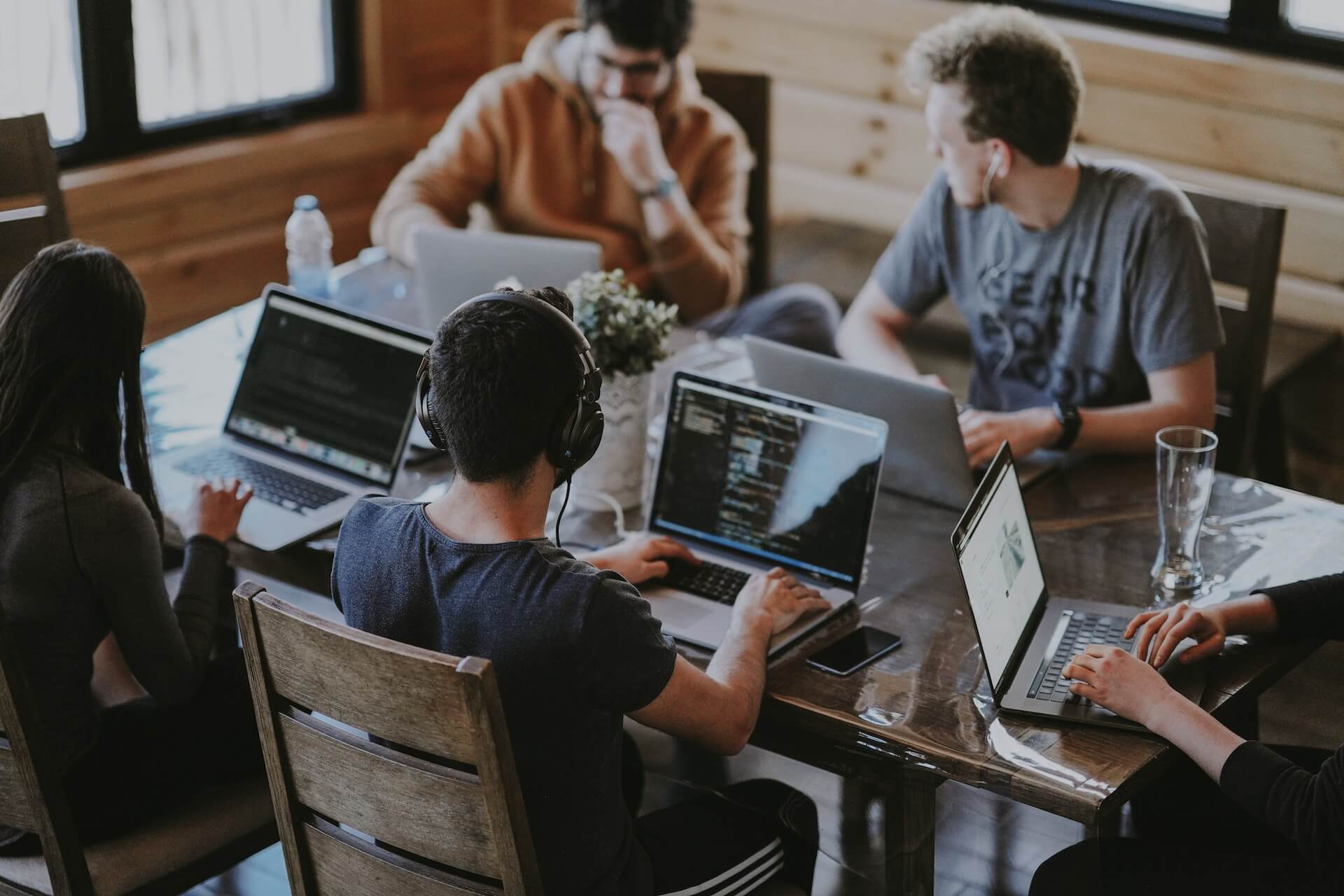 Team of customer support using laptops